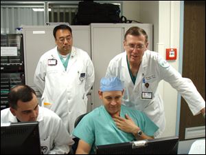 Dr. Ralph Whalen, far right, a vascular surgeon at Toledo Hospital’s Jobst Vascular Institute, joins military trauma surgeons at Landstuhl Regional Medical Center in Germany during his two-week stint.