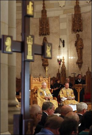 
Bishop of Toledo Leonard Blair, seated at left with other members of the clergy, prepares to present honors at Rosary Cathedral on Collingwood Boulevard.