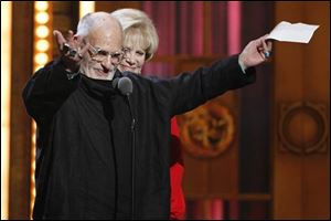 Larry Kramer, with Daryl Roth in the background, offers thanks for the Tony for Best Revival of a Play for 'The Norman Heart.' Two actors from the AIDS drama, Ellen Barkin and John Benjamin Hickey, also won.