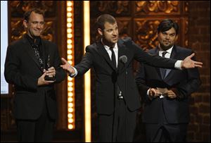 Matt Stone, flanked by co-winners Trey Parker, left, and Robert Lopez, accepts the Tony for Best Book of a Musical. They won for 'The Book of Mormon.' 