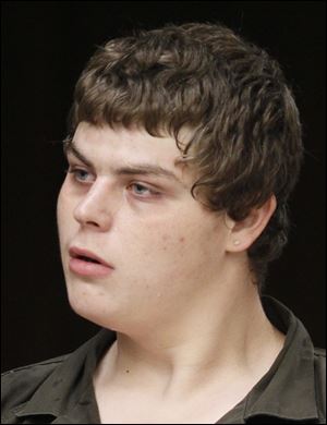 Jacob Dupuis is charged with assault for punching a gas station patron.