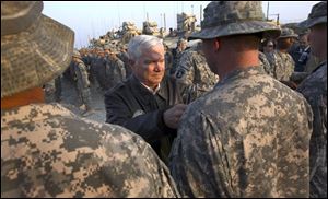 Defense Secretary Robert Gates, center, says military pressure is key to peace talks with Taliban. 