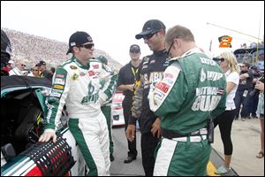 Dale Earnhardt, Jr., relaxes before the start of Sunday’s race at MIS. He wasn’t so calm after it was over. He finished 21st after teammate Mark Martin pushed him into the wall with fewer than 10 laps remaining.