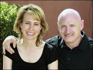 Rep. Gabrielle Giffords, left, D-Ariz., left, with her husband, NASA astronaut Mark Kelly before she was shot in the head Jan. 8 during a political event in Tucson, Ariz. 
