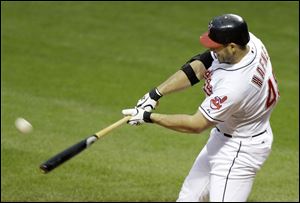 Cleveland's Travis Hafner hits a three-run home run off Colorado pitcher Juan Nicasio in the first inning.
