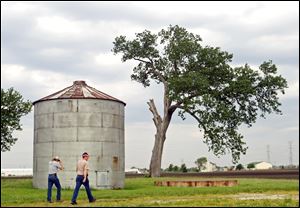 Brothers Bob and Ed Baltz, at their Shorewood, Ill., farm, have been buying farmland left undeveloped after the housing downturn.