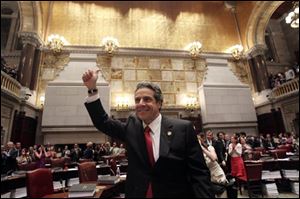 New York Gov. Andrew Cuomo reacts after same sex marriage was legalized after a vote in the Senate Chamber at the Capitol in Albany, N.Y.