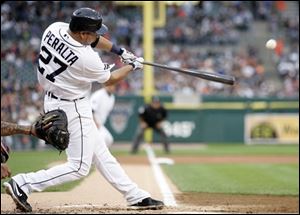 The Tigers' Jhonny Peralta hits a two-RBI double off Diamondbacks starter Zach Duke in the first inning.