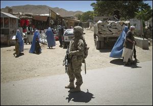 U.S. Army Spc. Natisha LeCount, of Brunswick, Ga., patrols the streets in Pul-e-Alam, the provincial capital of Logar province, south of Kabul, Afghanistan earlier this year.
