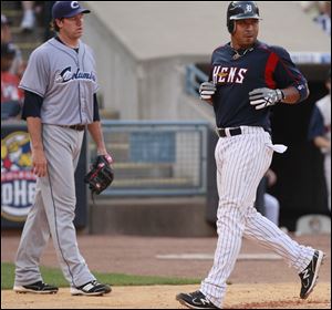 Carlos Guillen scores in the sixth as Columbus pitcher Zach McAllister watches. The Hens halted a 7-game losing streak to the Clippers.