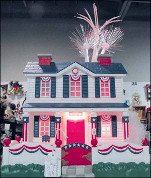 This model house features patriotic bunting and fireworks.