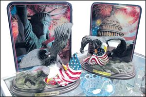 Flags and bald eagles adorn plates that come with a warning that they shouldn't be used for food. The plates are for sale at the Superior Antiques Mall at Erie Street Market.