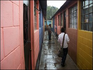 International Samaritan built these concrete-block houses in a neighborhood near the Francisco Coll school. The houses replace shanties made of plastic, cardboard, and tin where dump workers previously lived. The concrete-block houses have running water, a bathroom, and electricity and provide a sense of pride and safety.