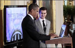 President Obama sends out a tweet to kick off his first-ever Twitter town hall.
