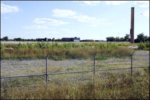 A lone smokestack is all that remains of the former Jeep assembly plant that is being prepared for reuse as an industrial complex with rail and expressway access. 