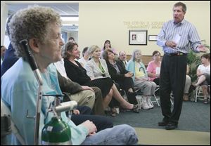 Gov. John Kasich tells residents of Viewpoint Apartments in Sandusky the new state budget will provide more assistance for senior citizens who want to live independently.
