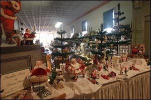 Christmas decorations line Beeker's General Store in Pemberville in celebration of the village's Christmas in July event.