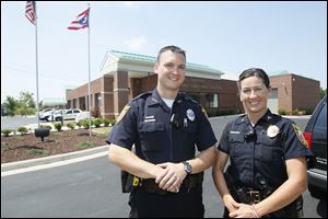 Perrysburg Township police officer David Molter, left, and Sgt. Monica Gottfried are putting together a 