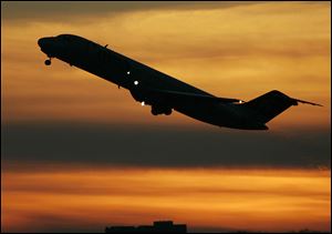 A plane takes off from Minneapolis St. Paul International Airport in Minneapolis in this file photo.