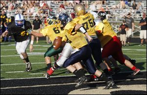 The Gold team’s Nick Rightnowar sprints out. He threw a pair of touchdowns.