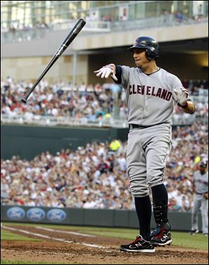 The Indians' Asdrubal Cabrera tosses his bat after striking out against Twins pitcher Francisco Liriano in the third inning.