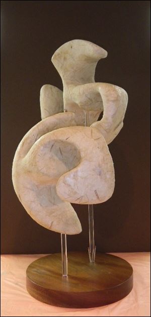 Part of Prizm's show at the Toledo Museum of Art, 'Slit Orb' by Bonnie Allan is a sculpture of foam, plaster, and gampi paper.