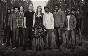 Derek Trucks, fifth from left, and Susan Tedeschi, center, with members of the Tedeschi Trucks Band, slated to perform at Centennial Terrace Sunday.