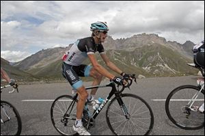 New overall leader Andy Schleck climbs Galipier pass during 19th stage of the Tour de France cycling race over 86 miles starting in Modane Valfrejus and finishing on Alpe d'Huez, Alps region, France.