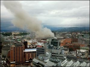 Smoke rises from the central area of Oslo on Friday after an explosion.