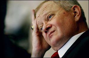 Author Tom Clancy fields questions at the Norfolk Naval Base in Norfolk, Va., in this 2004 file photo.