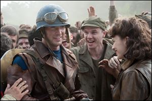 Chris Evens and Hayley Atwell, right, star as Steve Rogers and Peggy Carter in 'Captain America.'