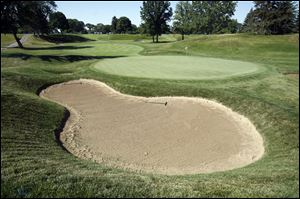One of the course's prettiest second shots, from the elevated fairway at No. 6, got prettier when Inverness spruced up the bunker complex around the green, including this giant pit behind the putting surface.