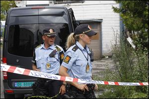 Armed police cordon off  a property in the east of Oslo, Norway  Sunday. Police confirmed the action was linked to Friday's bomb blast in Olso but gave no further details.