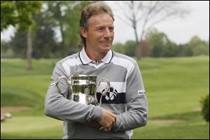 Bernhard Langer holds the 2010 U.S. Senior Open championship trophy during a visit to Inverness Club to promote this year's tournament. He played in 10 Ryder Cup events and was elected to the World Golf Hall of Fame.