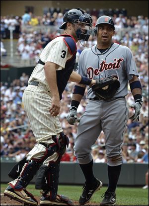 Twins catcher Joe Mauer tags out the Tigers' Carlos Guillen after he struck out in the ninth inning Saturday in Minneapolis.