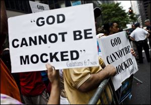 Anti-same-sex marriage protesters demonstrate in New York. Hundreds of gay and lesbian couples across New York began marrying on Sunday in the culmination of a long battle in the Legislature and a new milestone for gay rights advocates seeking to legalize same-sex marriage across the nation.