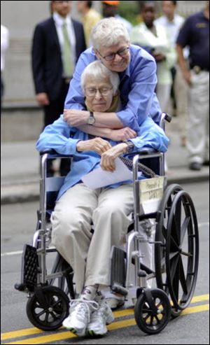 Phyllis Siegel, 77, hugs Connie Kopelov, 85, after becoming the first same-sex couple to get married at the Manhattan City Clerk's office on Sunday.