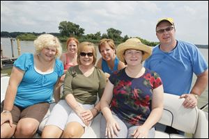 From left, Kelly Garrow, Meg Bonham (coral shirt), Carol Bintz, Karen Baker, Amy Gilman, and Larry Garrow at the MRYC party.