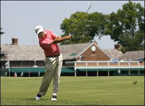 Olin Browne hits a shot from the fairway on No. 1 during the third round of the  2011 U.S. Senior Open  at the Inverness Club. 