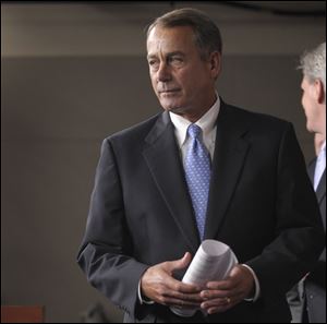 House Speaker John Boehner of Ohio prepares to speak during a news conference on Capitol Hill.