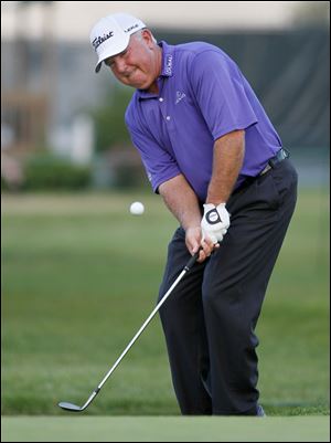 Mark O’Meara hits a chip shot onto the green at No. 9. He finished the day in second place with a 68. He carded three straight birdies in the middle of his round to get to 8-under through 11 holes after starting on the back nine. Mark Calcavecchia, Michael Allen, and Joey Sindelar are tied for third.
