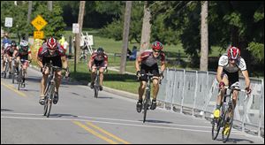 Approaching the finish line are the top three finisher, from left, Rick Slawinski, third; Woody Heinmann, of Findlay, in second and almost directly behind first place finisher Trevor Miller, of Columbus.