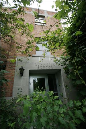 Luna Pier's mayor, Mary Liske, and a resident, Beth Mooney, urged the school board to do something about the vacant and deteriorating Luna Pier School.