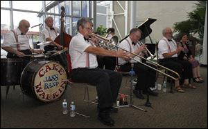 Cakewalkin' Jass Band performs at the Toledo-Lucas County Public Library. The band selected the library to donate the its memorabilia as a way to document an important part of Toledo's musical history.