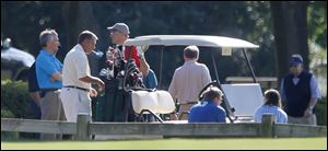 House Speaker John Boehner (R., Ohio), second from left, smokes Wednesday as he prepares to play golf at the Inverness Club in Toledo as part of a fund-raiser for U.S. Rep Bob Latta (R., Ohio), left. 