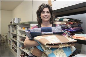 Janice Grimes, executive director of Quilts of Compassion, founded the group in 1999 after being hospitalized for a year with injuries she suffered in an auto accident. 