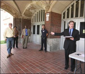 Keith Wilkowski, right, conducts the auction at Libbey High School. Contents of the school's field house and skills center were sold during the auction Wednesday. Libbey High School opened in 1923 and was closed in 2010. Demolition is scheduled to begin in December.