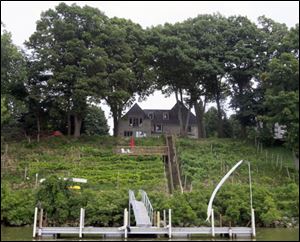 A view of the Bunda home and vineyard from the Maumee
River.