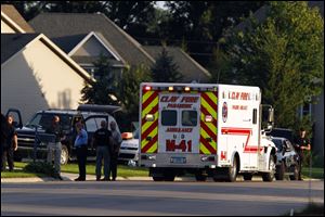 Former University of Notre Dame assistant football coach Corwin Brown is transported via ambulance to a hospital Friday after a self-inflicted gunshot wound following a standoff with St. Joseph County SWAT at his home in Granger, Ind.