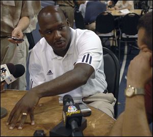 Then Notre Dame defensive coordinator Corwin Brown answers a question during Media Day in South Bend, Ind., in this Aug. 6, 2007 file photo.